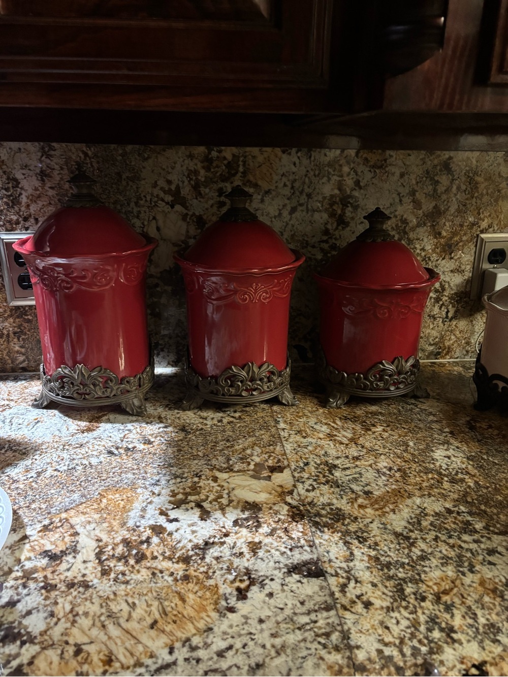 Classic Red Decorative Canister Set with Ornate Metal Accents